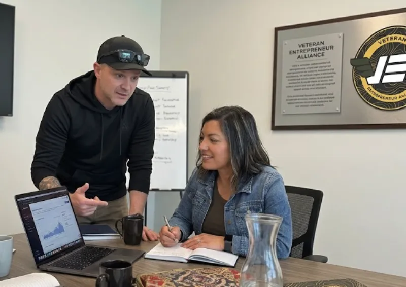 VEA team working one-on-one with a veteran entrepreneur on business strategy